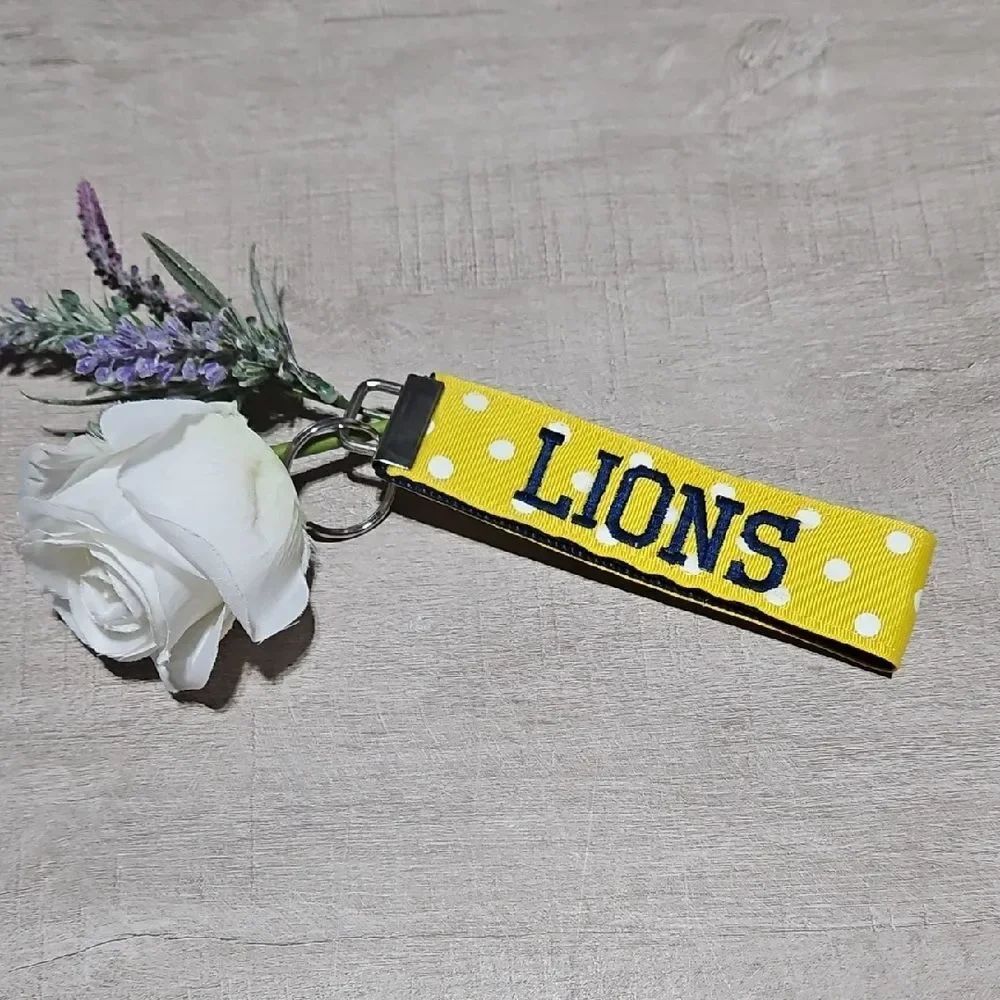 Lions 🎁 Yellow, White Polka Dot, and Navy Blue Strap Key Holder Bag Charm